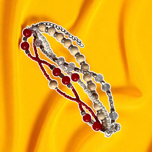 Three beaded bracelets on a yellow fabric background